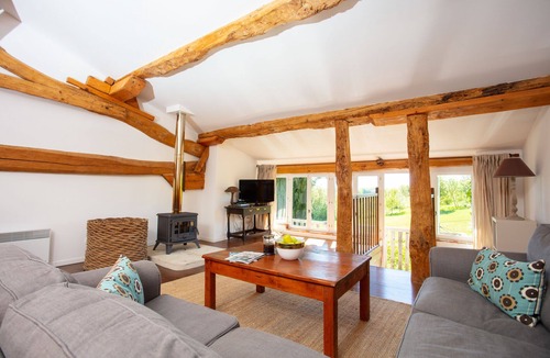 Beauville House | Mutley Barn over looks the unspoilt country-side with floor to ceiling windows.