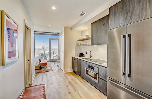 Rainey Street Historic District Apartment | Natiivo Austin studio - lake & skyline-view balcony, pool & gym - dogs OK