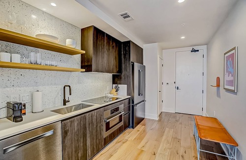Rainey Street Historic District Apartment | Natiivo Austin studio - lake & skyline-view balcony, pool & gym - dogs OK