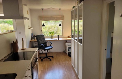 Klitmoller Cottage | Natural plot fireplace and true west coast