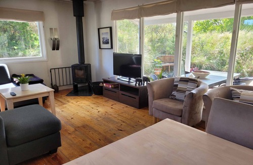 Klitmoller Cottage | Natural plot fireplace and true west coast