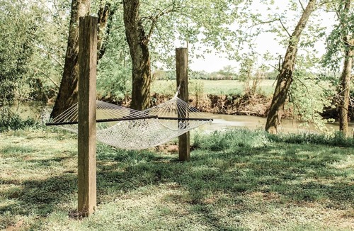 Fayetteville Cabin | Nature's Tiny Riverside Hideaway