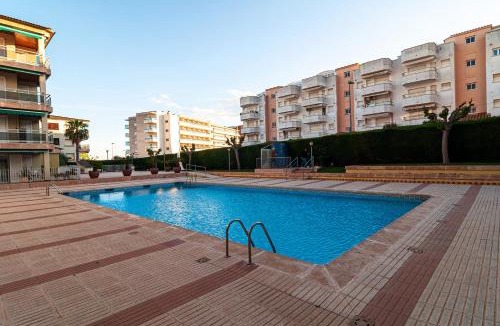 Comarruga Apartment | Near beaches large private patio, aircon & community pool