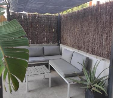 Comarruga Apartment | Near beaches large private patio, aircon & community pool