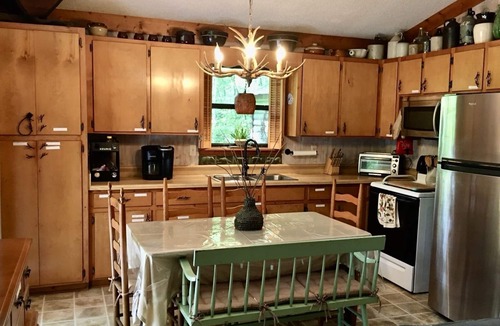 Almond Cabin | Near Bryson, Fontana, Pets Ok, outdoor dining, grill, Fire pit, and gated deck