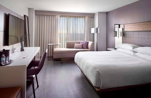Downtown Hotel | Near Red Hat Amphitheater + Dining. Pool. Gym.