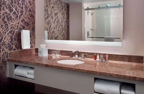 Downtown Hotel | Near Red Hat Amphitheater + Dining. Pool. Gym.