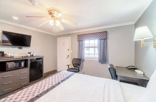 Ira Hotel | Near Sammy Baugh Golf Course & Local Dining Spots | Queen Bed Non‑Smoking