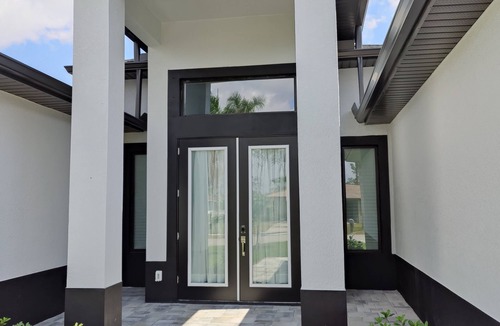 Trafalgar House | New Construction - Elegant Fresh Water Canal Home w/Heated Pool
