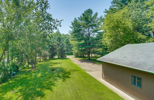Amery House | NEW LISTING! Timber Ridge Lake House is a private lake home in Amery Wisconsin on Lake Wapogasset. The home balances the warmth of a large A-Frame with modern decor and finishes providing a serene stay with woods and lake views.