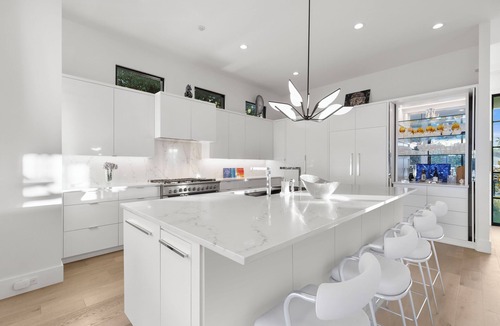 Northwest Dallas House | New luxury modern home in Midway Hollow with heated pool, private casita, indoor/outdoor living, designer furnishings, garage, and concierge service. Perfect for families, groups, or extended stays.
