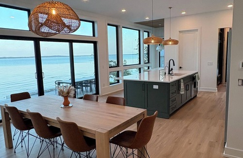 Suttons Bay House | New Waterfront Home with Private Beach