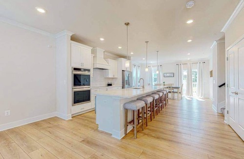 Ocean City Condo | Newly built row-end townhome with water view, pool access, patio, & balcony