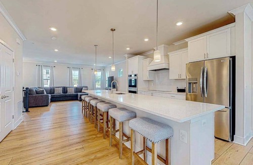 Ocean City Condo | Newly built row-end townhome with water view, pool access, patio, & balcony