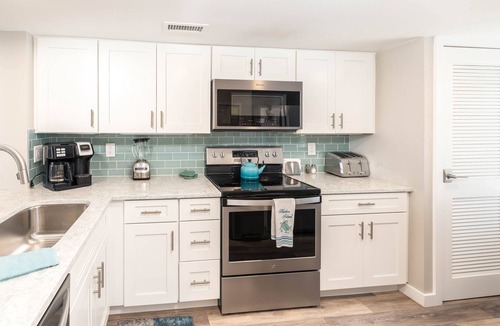 Oceanmarsh Subdivision Condo | Newly Listed Immaculate Condo - Distant Ocean Views - Pool and Beach Access