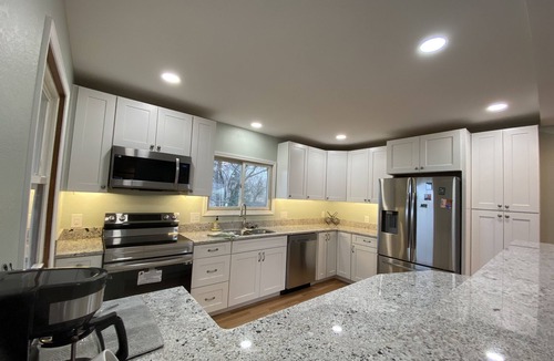 Des Moines House | Newly Remodeled Brick Home with wall Sculptures by the Airport