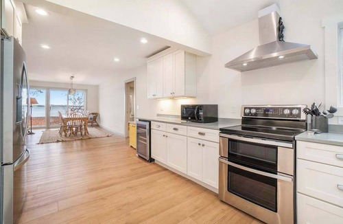 Lake Township House | Newly remodeled lake house with amazing views, dock, firepit & vibrant interior