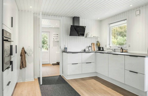 Ulfborg House | Nordic log house between sea and fjord