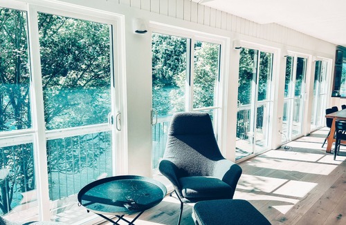 North River Cottage | Nordic Style Private Riverfront Cottage with Heated Pool & Hot Tub