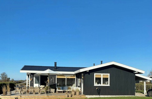 Skastrup Strand House | North Funen summer house with view and style