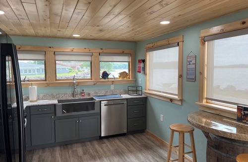 Sandy Creek House | North Sandy Pond Lakehouse with dock and hot tub