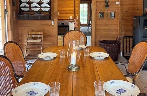 Rrvig House | Norwegian log cabin among heather and pine trees