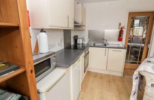 Ivegill Cottage | NUTHATCH, pet friendly, with open fire in High Head Castle Farm