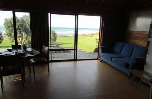 Mataikona House | Ocean-front beach house with warm outside shower.