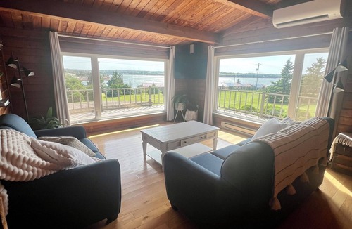 Bayview Cottage | Ocean view cottage with a perfect wrap around deck to watch beautiful sunsets.