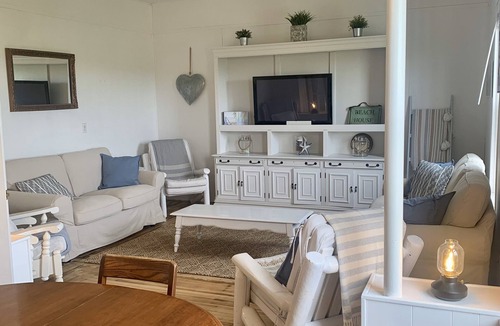 Cape Traverse Cottage | Oceanfront cottage. Steps to the beach, pet & family friendly. .