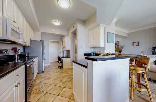 American Beach House | Oceanfront, gated community townhome with private W/D, beach & pool access