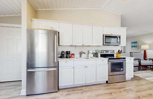 North Truro House | Oceanfront hotel suite at beachfront Sandbars Inn with balcony AC & firepit