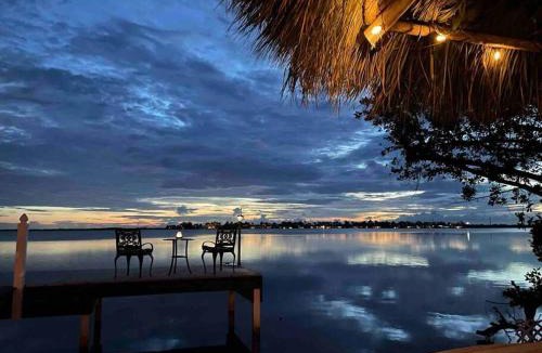 Bay Point House | Oceanfront villa with private beach, heated pool, tiki and boat dock