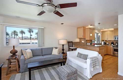 Townsite Condo | OCEANSIDE BEACH located by pier and marina! Ocean Views! Walk to Village!
