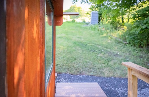 Town of Broome Cabin | Off-Grid, Buck Tiny House with Indoor Soaking Tub & Mountain Top Views