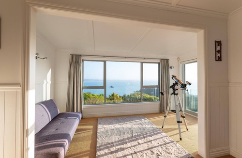 Omiha House | Ōmiha Oasis - Ōmiha Oasis is a premium family holiday home with spectacular views and wonderful amenities set in the tranquil surroundings of Ōmiha (Rocky Bay), Waiheke Island. The property has three bedrooms and two bathrooms, making it perfect for