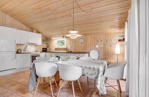 Vorupør House | On a hilly natural plot surrounded by trees, lies this beautiful wooden vacation home.