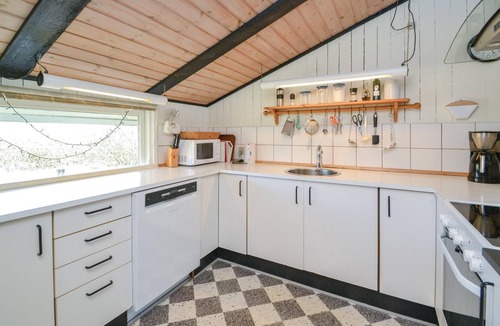 Rindby Strand House | On an attractive dune plot in Rindby lies this well-maintained, beautiful summer house, which is exc