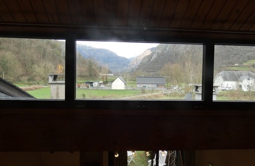 Aste-Beon House | On river bank with mountain views and ground-level terrace