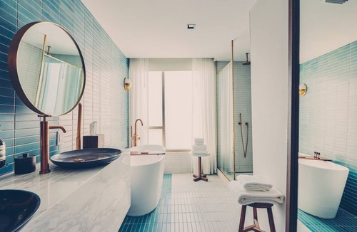 South River City Hotel | One-Bedroom Hotel Suite with Living Room & Outdoor Space
