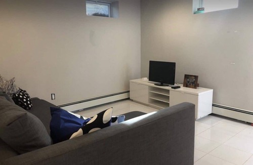 Greenlawn Apartment | Open bright airy basement apartment