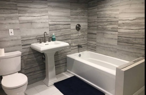 Greenlawn Apartment | Open bright airy basement apartment