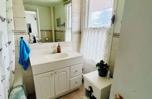Peterborough Apartment | Open Concept meets Cottage~core in this charming home above a corner store