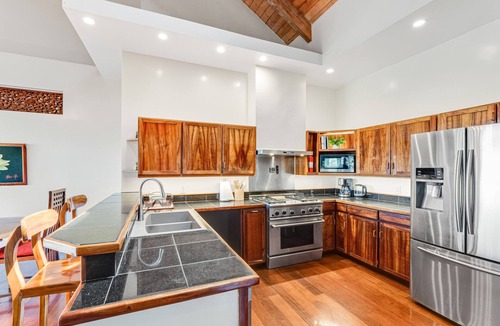 Honokaa House | Open concept villa with a tropical garden setting, lanai & patios