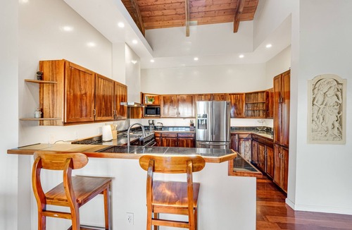 Honokaa House | Open concept villa with a tropical garden setting, lanai & patios