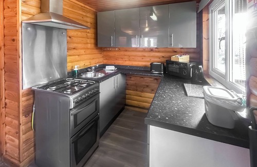 Ystradgynlais Ski Chalet | Open plan lodge with two doubles, both with TV/DVD.