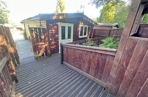 Ystradgynlais Ski Chalet | Open plan lodge with two doubles, both with TV/DVD.