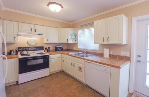 Holmes Beach Villa | Palm Oasis East Villa, Shared Heated Salt Pool, Steps to the Beach, Ground Level