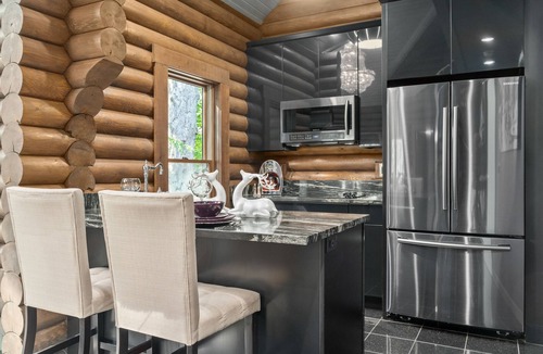 Logan Cabin | Paris Art Deco-Romanic-Opulent-Massage Chair-Sauna-Hot Tub-Kayaks-FireTable