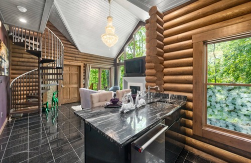 Logan Cabin | Paris Art Deco-Romanic-Opulent-Massage Chair-Sauna-Hot Tub-Kayaks-FireTable